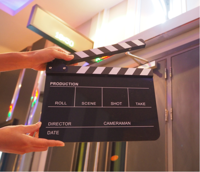 Hand closing clapperboard