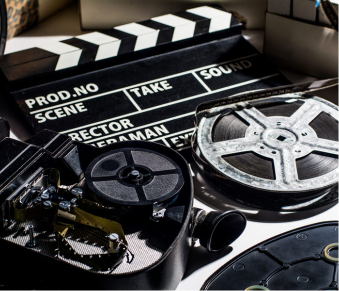 Clapperboard and film rolls