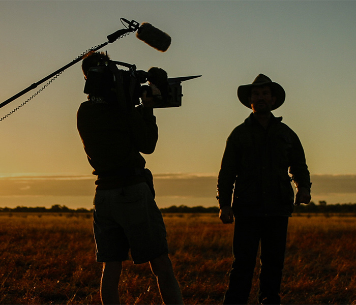 film crew at sunset